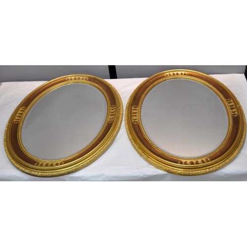 82 - PAIR OF OVAL DECORATIVE GILT FRAMED, BEVEL EDGE MIRROR