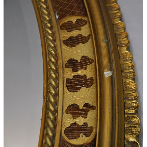 82 - PAIR OF OVAL DECORATIVE GILT FRAMED, BEVEL EDGE MIRROR