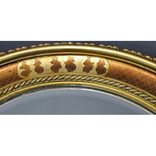 82 - PAIR OF OVAL DECORATIVE GILT FRAMED, BEVEL EDGE MIRROR