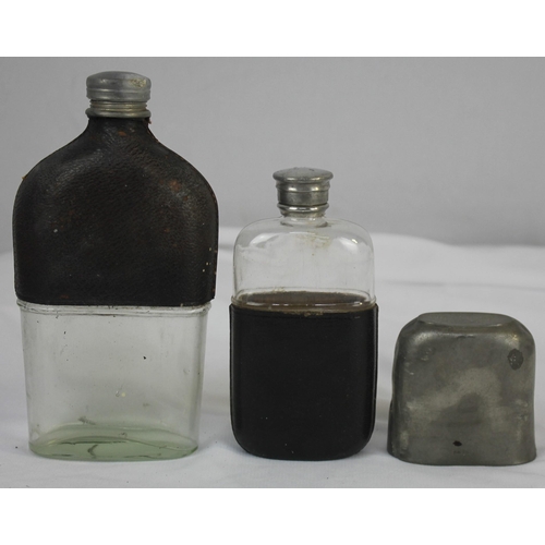 95 - GLASS FLASK WITH CUPS IN LEATHER CASE AND VARIOUS FLASKS