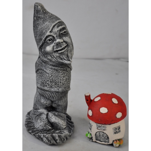 194 - 5 GARDEN ORNAMENTS - TOAD, MUSHROOM HOUSE, GNOME, DOG WITH A BOW AND A DOG