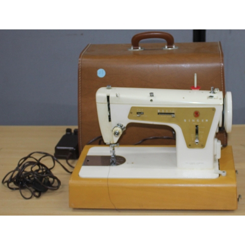 242 - SINGER SEWING MACHINE IN CASE