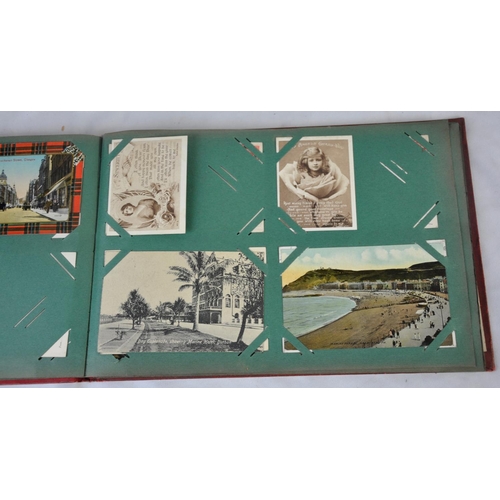 296 - RED POSTCARD ALBUM OF POSTCARDS