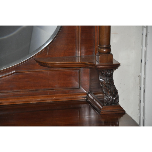 161 - WALNUT MIRROR BACK SIDEBOARD WITH PILLAR SUPPORT, OVAL BEVEL EDGE MIRROR AND BOWED DOORS TO BASE, ON... 