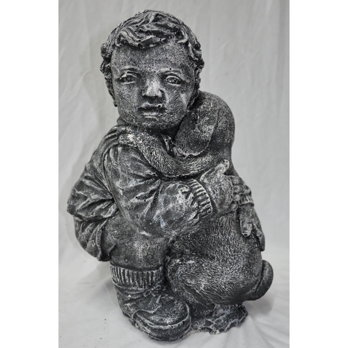 46 - BOY HUGGING DOG GARDEN ORNAMENT