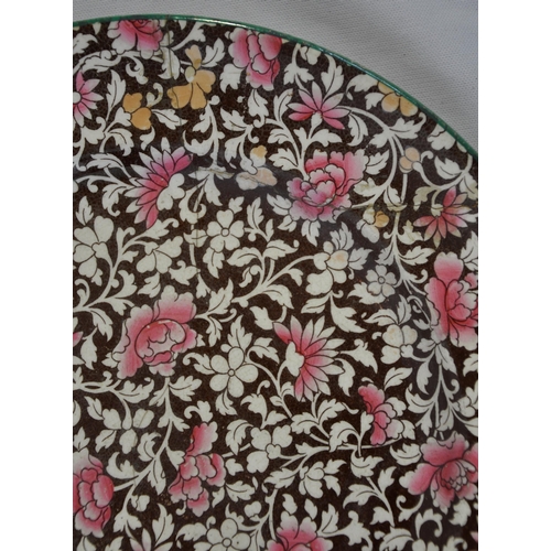 381 - PINK AND BROWN DECORATED PORCELAIN PLATE - LABEL ON REVERSE 