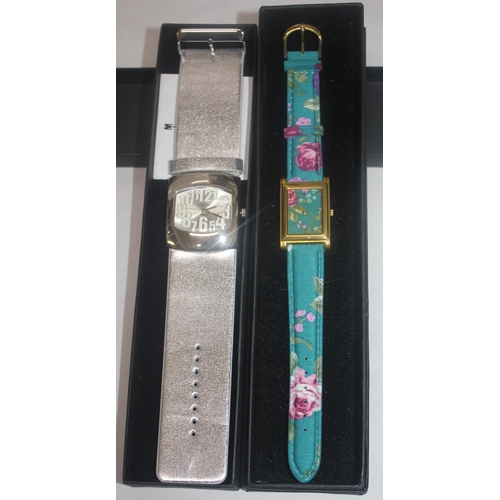 386 - 2 LADIES NEW & BOXED 'GOSSIP' WATCHES: GREEN FLORAL WATCH WITH STRAP (191922) & SILVER COLOU... 