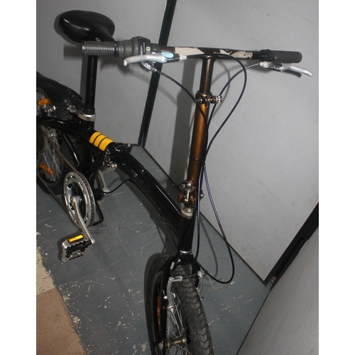 9 - BLACK AND ORANGE FOLDING BIKE