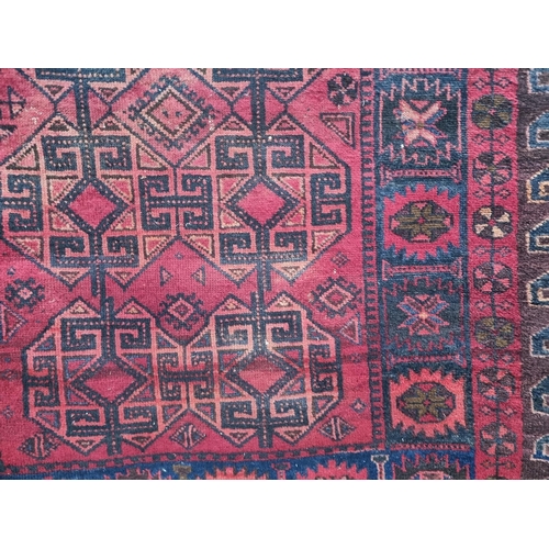 75 - RED PATTERNED RUG. 6FT X 4'9