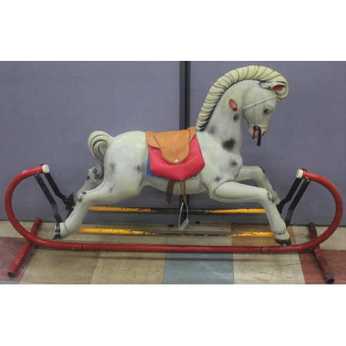 85 - PLASTIC ROCKING HORSE ON METAL BASE