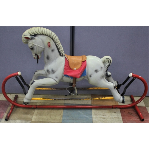 85 - PLASTIC ROCKING HORSE ON METAL BASE