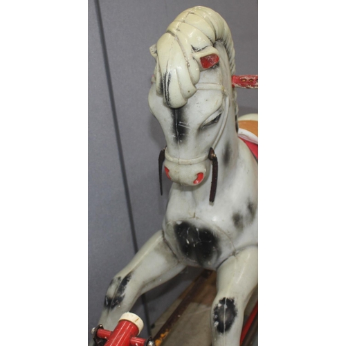 85 - PLASTIC ROCKING HORSE ON METAL BASE