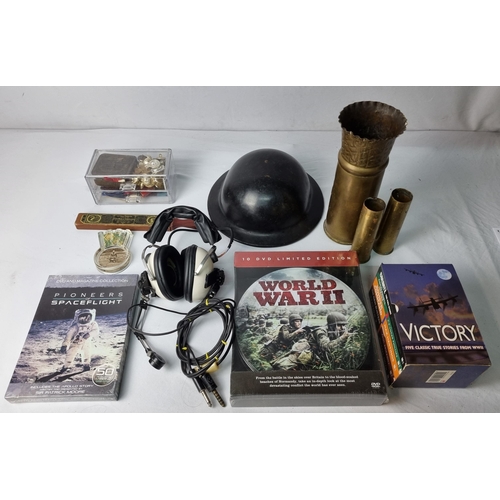 9 - MILITARIA INCLUDING TRENCH ART, BADGES, NASA ISSUED HEADSET, HELMET, DVDS, ETC