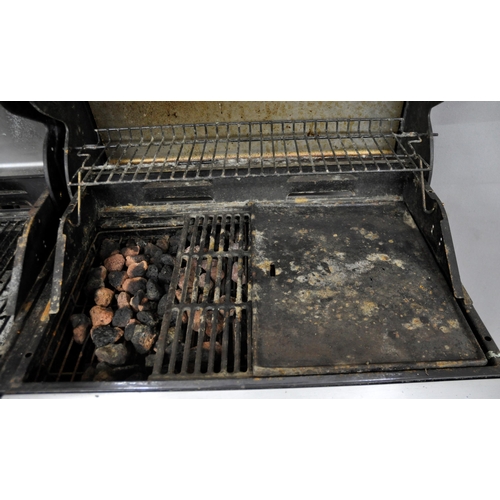 307 - OUTBACK COMBI CHARCOAL AND GAS 4 BURNER  BBQ - HANDLES AND 1 SIDE TABLE NEED RE-ATTACHING