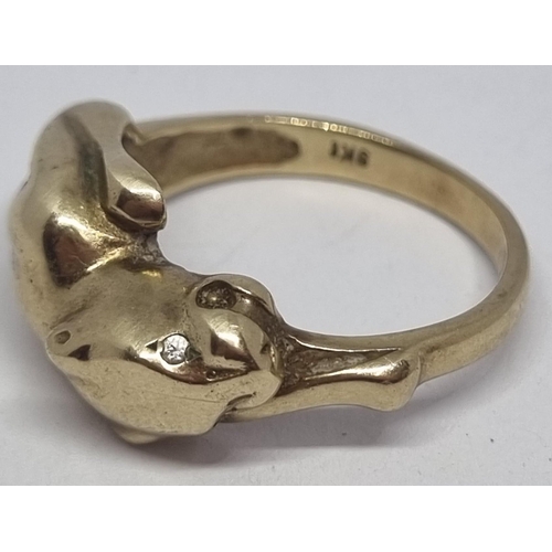 407 - YELLOW METAL COUGAR DESIGN RING - MARKED 9kt  (SIZE O) (4.2g)