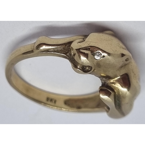 407 - YELLOW METAL COUGAR DESIGN RING - MARKED 9kt  (SIZE O) (4.2g)