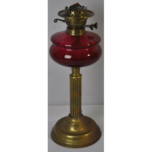 14 - BRASS AND CRANBERRY GLASS OIL LAMP