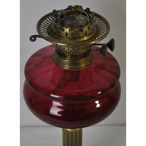 14 - BRASS AND CRANBERRY GLASS OIL LAMP