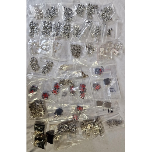 36 - TUB AND BAG OF PENDANTS, CHARMS AND BEADS