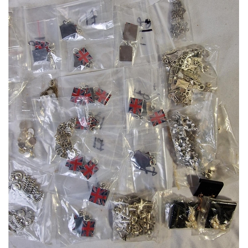 36 - TUB AND BAG OF PENDANTS, CHARMS AND BEADS