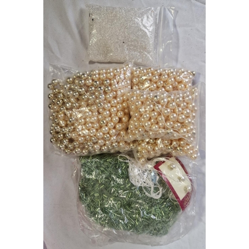 105 - BOX AND 4 TUBS OF BEADS ETC