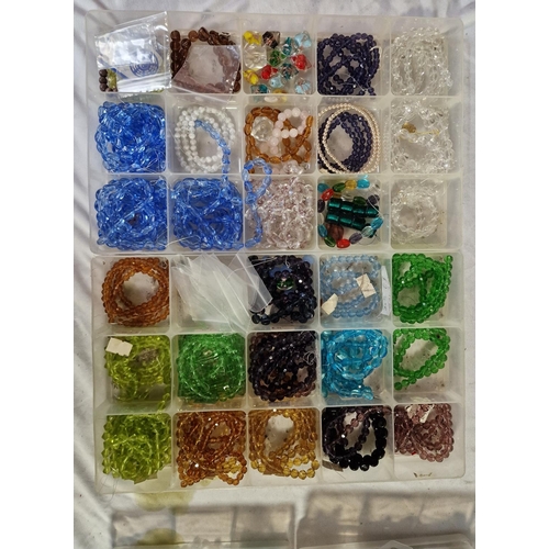 105 - BOX AND 4 TUBS OF BEADS ETC