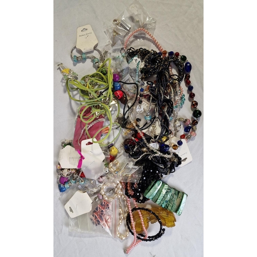 133 - 4 TUBS OF COSTUME JEWELLERY - BROOCHES, NECKLACES, BRACELETS, ETC