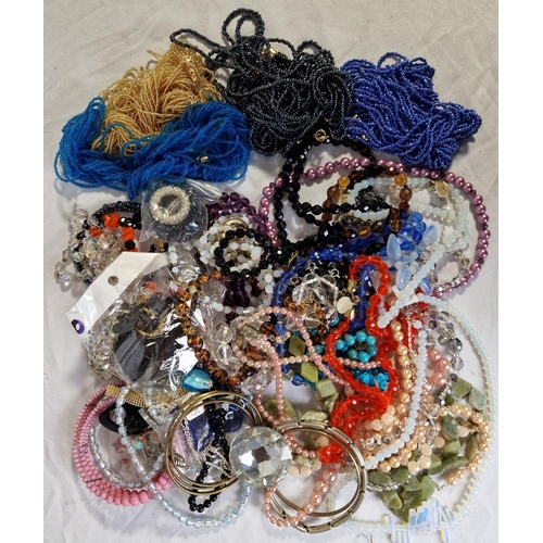 133 - 4 TUBS OF COSTUME JEWELLERY - BROOCHES, NECKLACES, BRACELETS, ETC