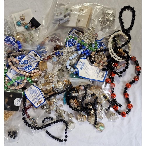 133 - 4 TUBS OF COSTUME JEWELLERY - BROOCHES, NECKLACES, BRACELETS, ETC