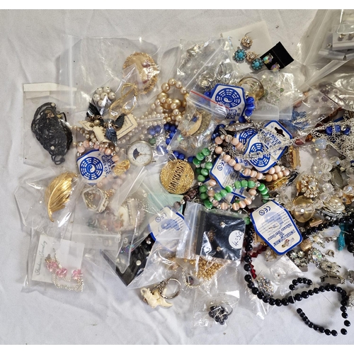 133 - 4 TUBS OF COSTUME JEWELLERY - BROOCHES, NECKLACES, BRACELETS, ETC