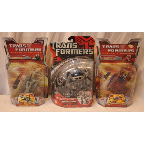 88 - 5 NEW TRANSFORMER TOYS AND 1 BOOK