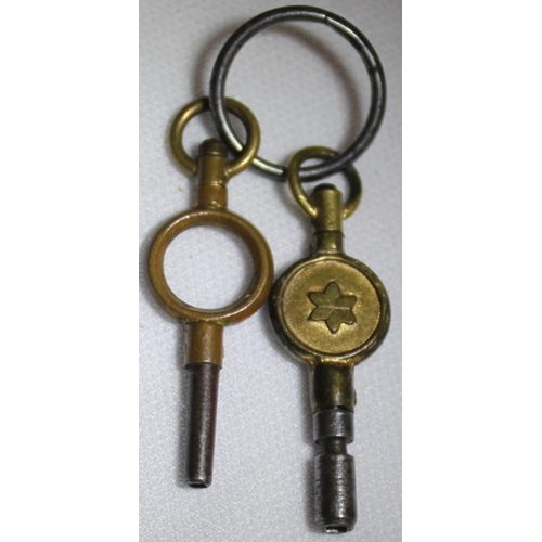 261 - MASONIC POCKET WATCH IN SILVER WATCH HOLDER AND 2 KEYS