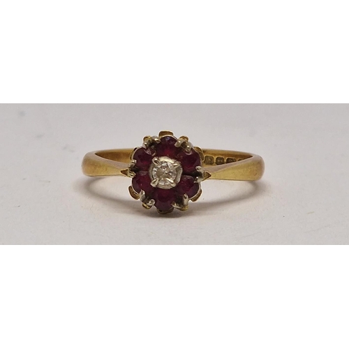 281 - 18 CARAT GOLD CLUSTER RING SET SOLITAIRE DIAMOND AND SIX RUBIES - SIZE K (3.1g)