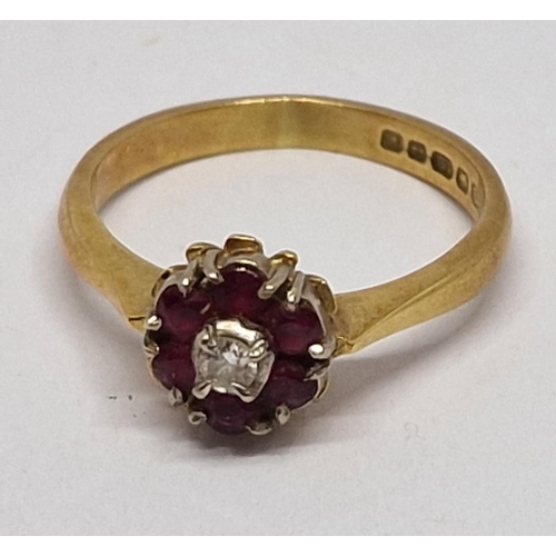 281 - 18 CARAT GOLD CLUSTER RING SET SOLITAIRE DIAMOND AND SIX RUBIES - SIZE K (3.1g)