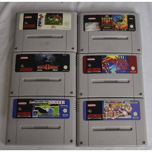 52 - 2 SUPER NINTENDO SYSTEMS, 4 CONTROLLERS, 6 GAMES
