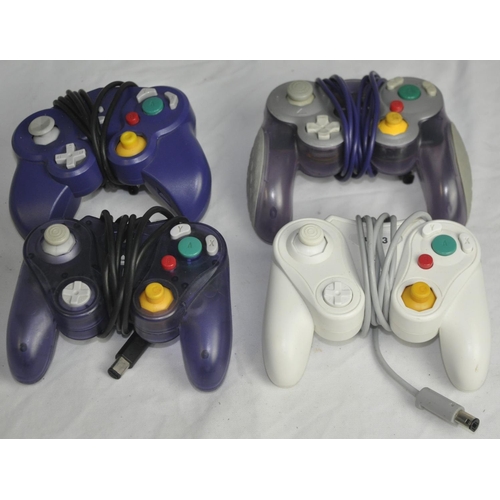 222 - 3 GAME CUBE CONSOLES, 4 CONTROLLERS AND 13 LOOSE GAMES