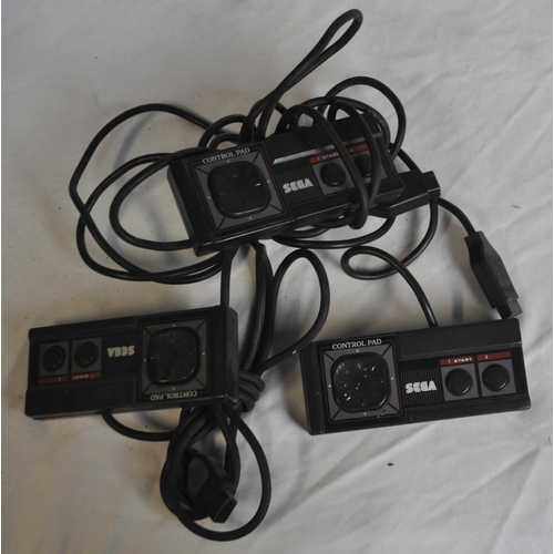 233 - 2 SEGA MASTER SYSTEM CONSOLES, 3 CONTROLS PADS, 5 BOXED GAMES. 1 AC POWER SUPPLY