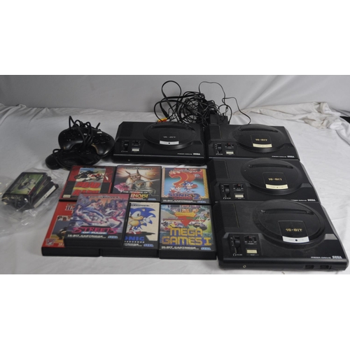 340 - 4 SEGA MEGA DRIVES, 3 CONTROL PADS (1 NEEDS ATTENTION), 2 AC ADAPTERS, 7 BOXED AND 4 LOOSE GAMES