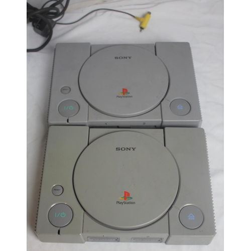 415 - 2 SONY PLAYSTATION CONSOLES, PSX STEERING WHEEL WITH FOOT PEDALS FOR PLAYSTATION & 2 NAMCO NPC-1... 