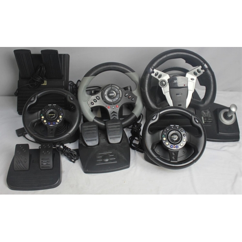 452 - 3 GAMING STEERING WHEELS & 3 SETS FOOT PEDALS