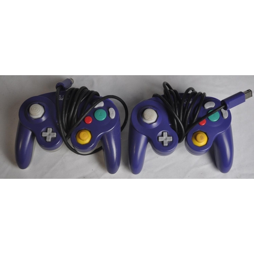 235 - PURPLE NINTENDO GAME CUBE, 2 OFFICAL CONTROLLERS, 1 MEMORY CARD, POWER SUPPLY AND 4 BOXED, 6 LOOSE G... 