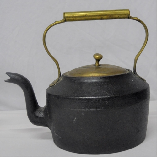 133 - 2 CAST IRON KETTLES AND TRIVET STAND