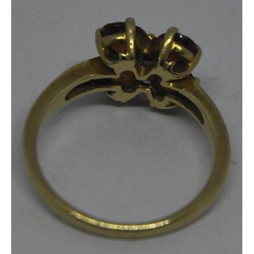 387 - 9ct GOLD FLOWER DESIGN RING SET RED STONES & DIAMONDS (SIZE 0) (3.1g)