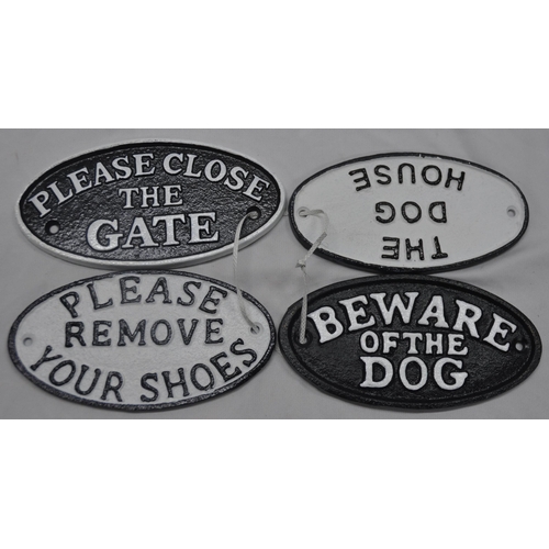 101 - 4 OVAL CAST IRON SIGNS