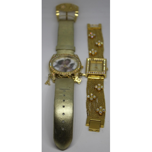 425 - 2 LADIES WATCHES: GOLD COLOURED ANGEL WATCH & GOLD COLOURED BRACELET WATCH WITH STONE SET FACE