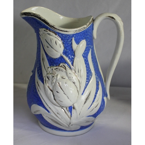 149 - 23 JAMES DUDSON VICTORIAN BLUE AND WHITE STONEWARE MOULDED TULIP JUGS