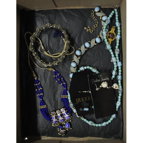 276 - 4 BOXES OF COSTUME JEWELLERY