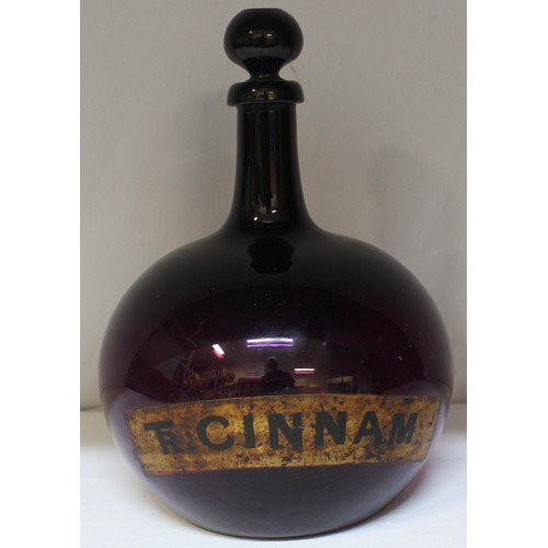 335 - LARGE CHEMIST APOTHECARY BOTTLE WITH TAPERING NECK AND BULBOUS BODY - LABEL FOR TR CINNAM