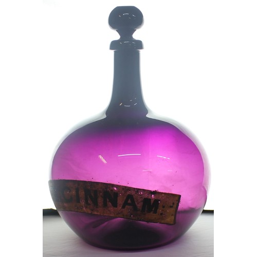 335 - LARGE CHEMIST APOTHECARY BOTTLE WITH TAPERING NECK AND BULBOUS BODY - LABEL FOR TR CINNAM