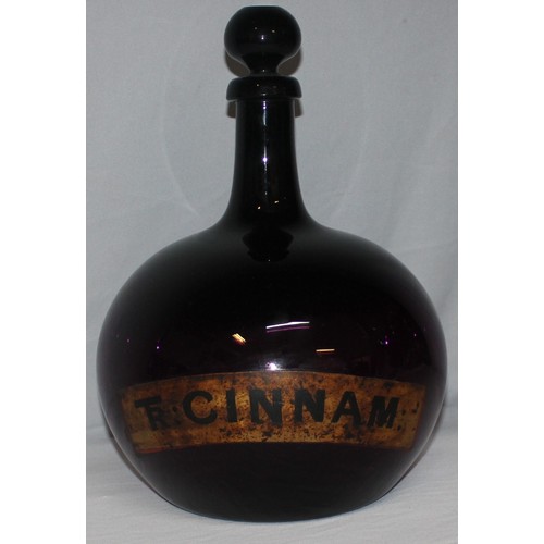 335 - LARGE CHEMIST APOTHECARY BOTTLE WITH TAPERING NECK AND BULBOUS BODY - LABEL FOR TR CINNAM